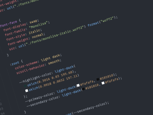 Computer code in varying colours on a dark background